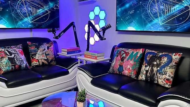 760 Media creative studio lounge with couch, microphones, and display screens
